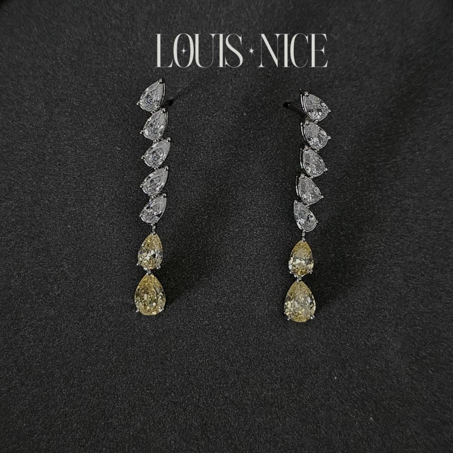 Silver zircon set, two layers, with yellow stones