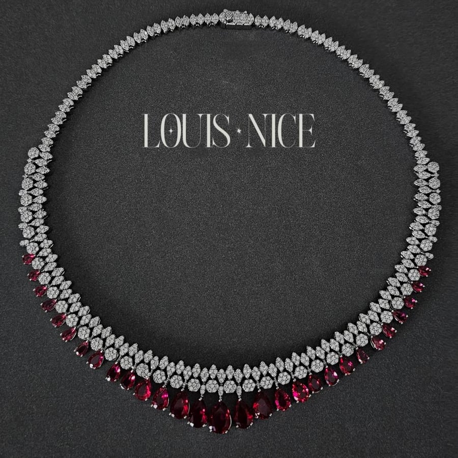 Zircon set in silver and red with diamond-like precision