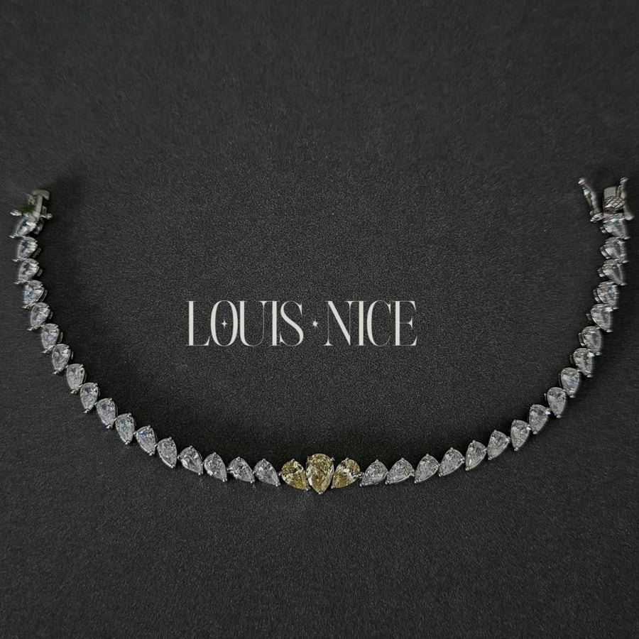 Silver zircon set, two layers, with yellow stones