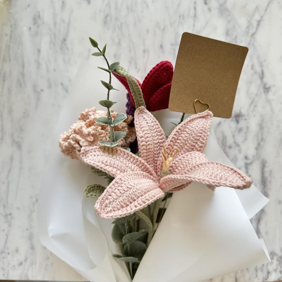 A bouquet of flowers with a card