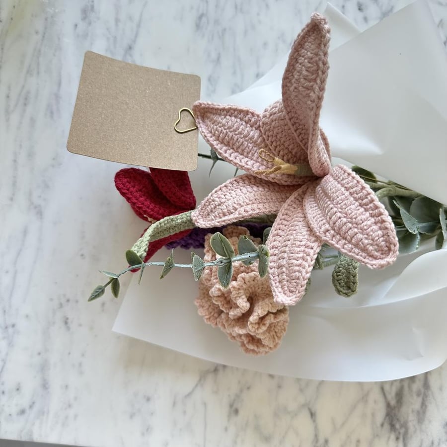 A bouquet of flowers with a card