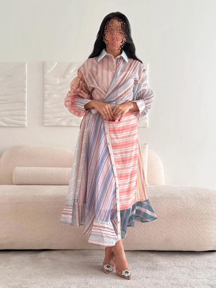 A shirt-style dress made of pastel-colored striped fabric