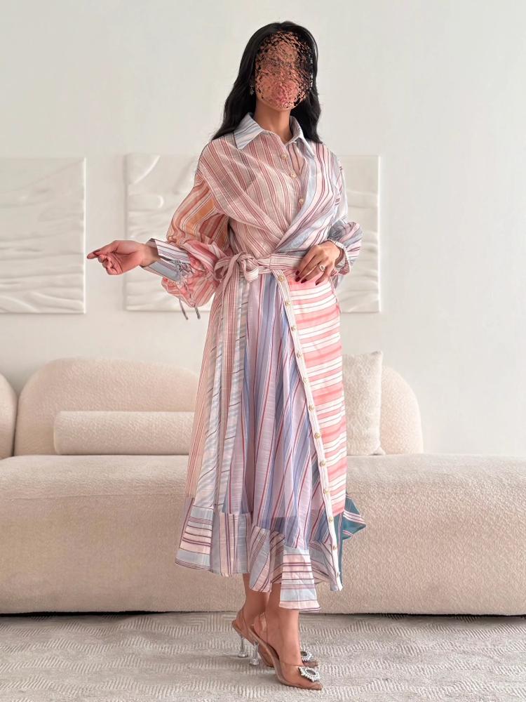 A shirt-style dress made of pastel-colored striped fabric