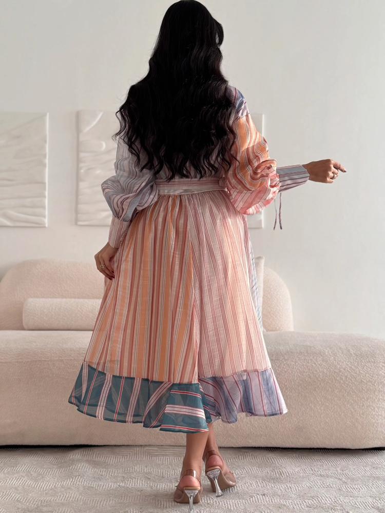 A shirt-style dress made of pastel-colored striped fabric