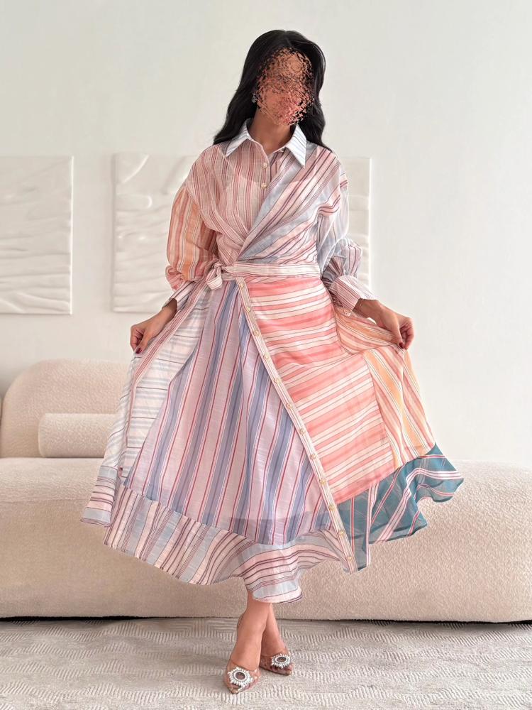 A shirt-style dress made of pastel-colored striped fabric