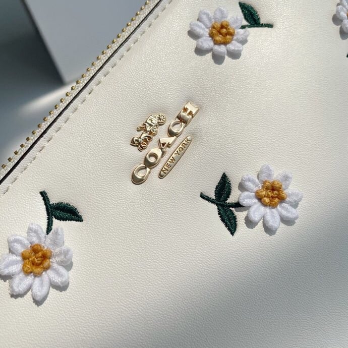 Coach wallet with daisy embroidery