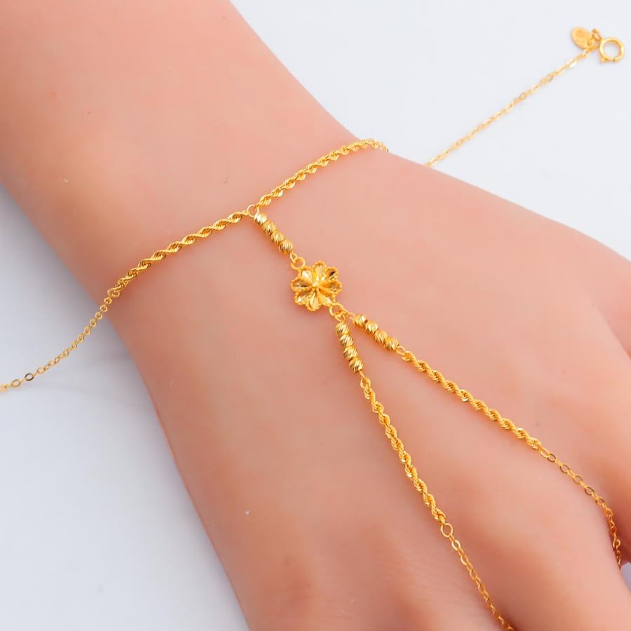 A 21-karat gold palm weighing 2.39 grams