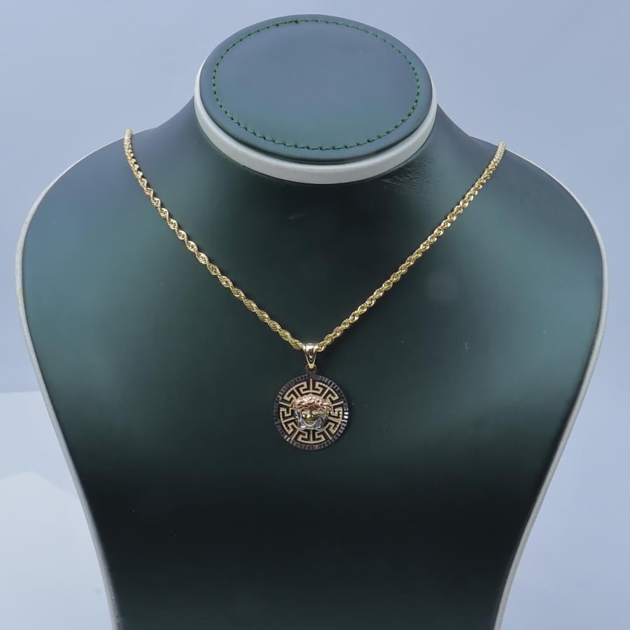 Pendant with chain, Versace design, 18 karat gold, weighing 6.94 grams