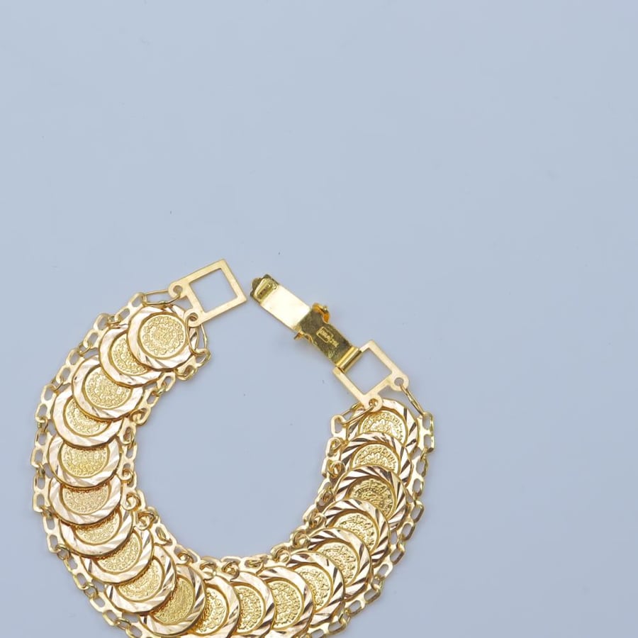 21-karat gold fairy design bracelet, weighing 13.2 grams