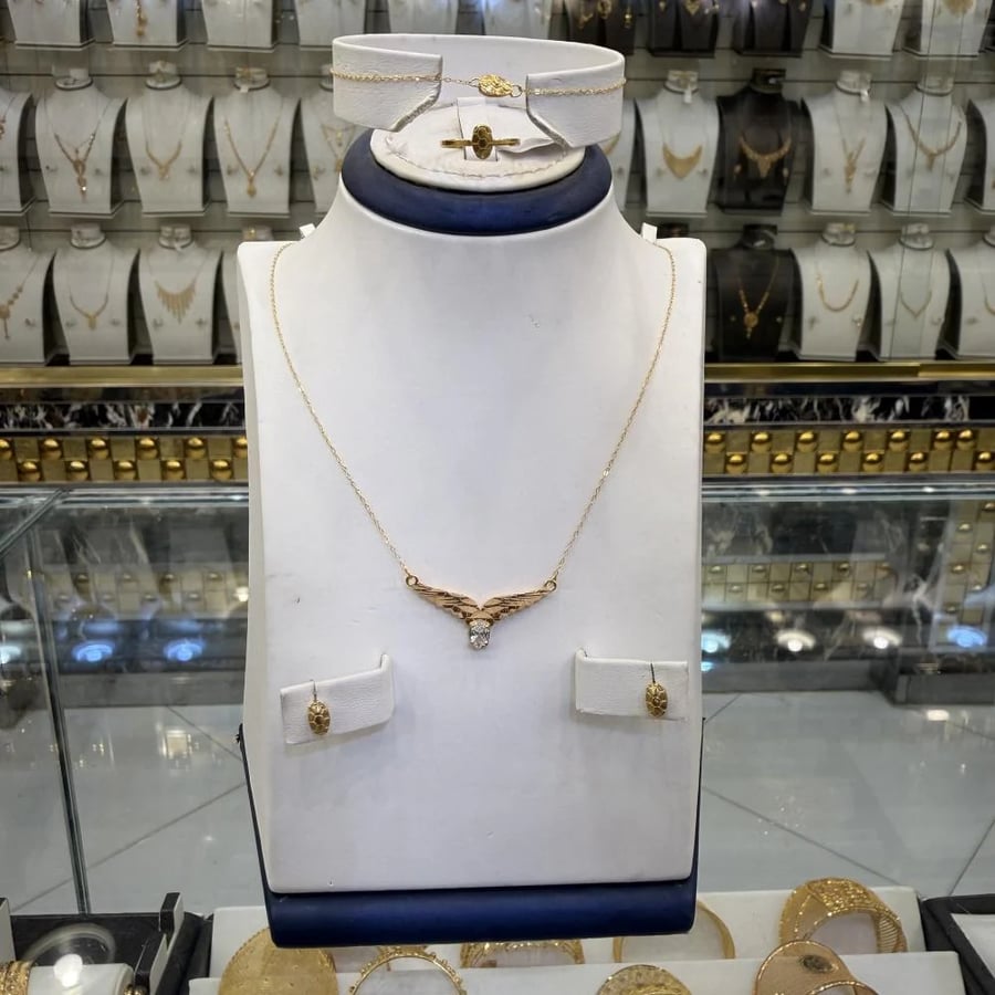 طقم ذهب جناح الصقر