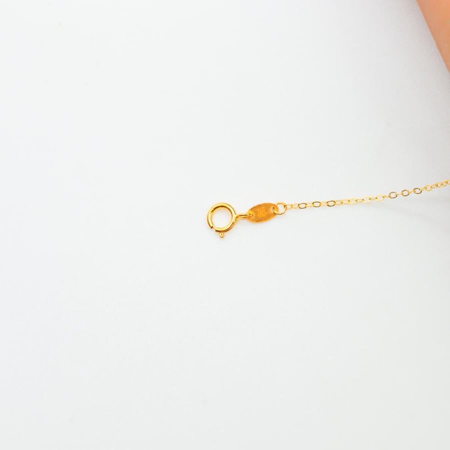 A fine gold palm, 21 karat, weighing 1.05 grams