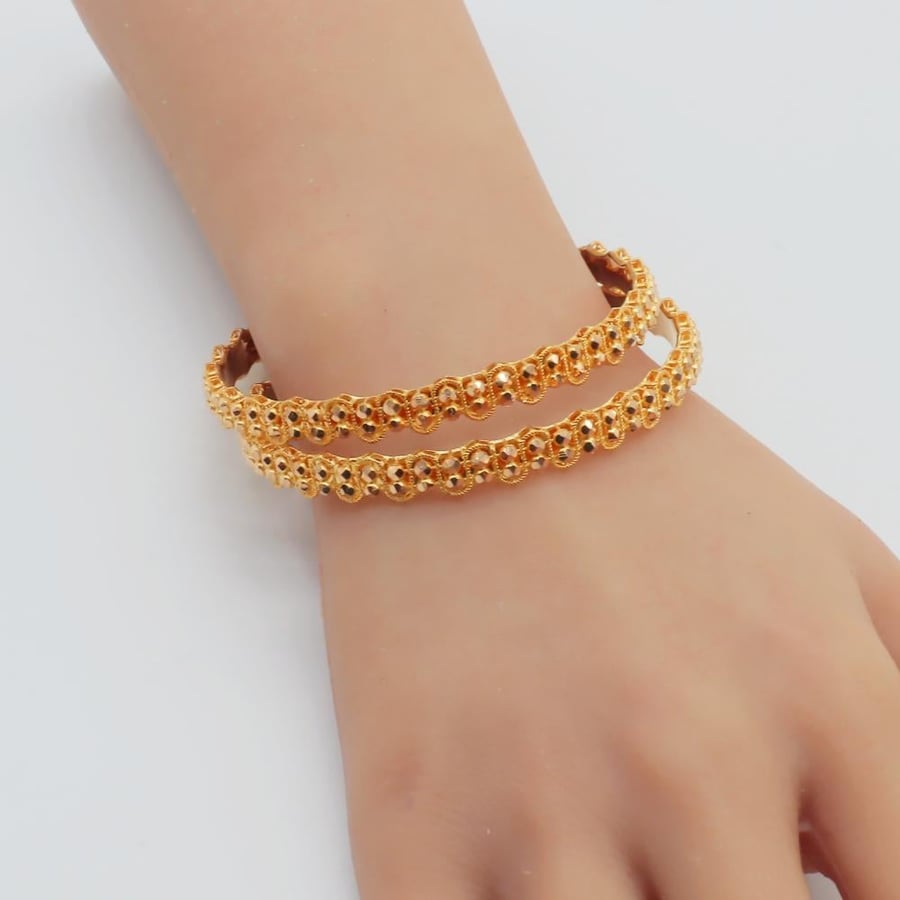 21-karat gold Doric wavy bangles