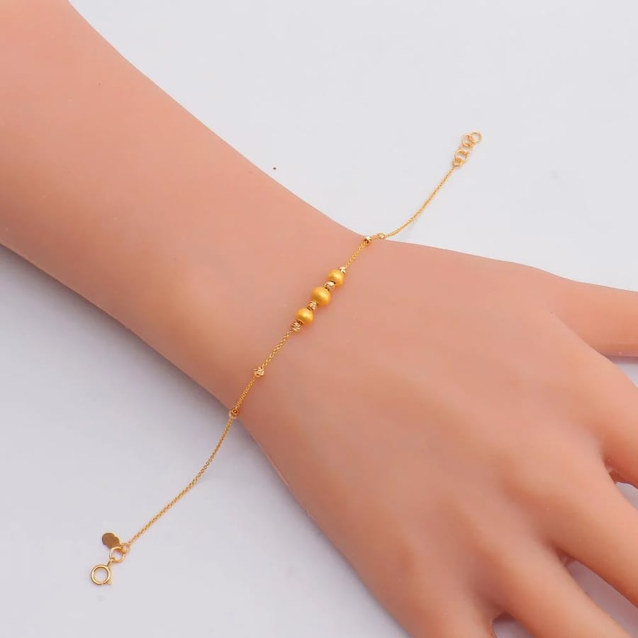 اسوارة ذهب ناعمه عيار 21 بتصميم كرات دوريكاء وزن 1.68 جرام