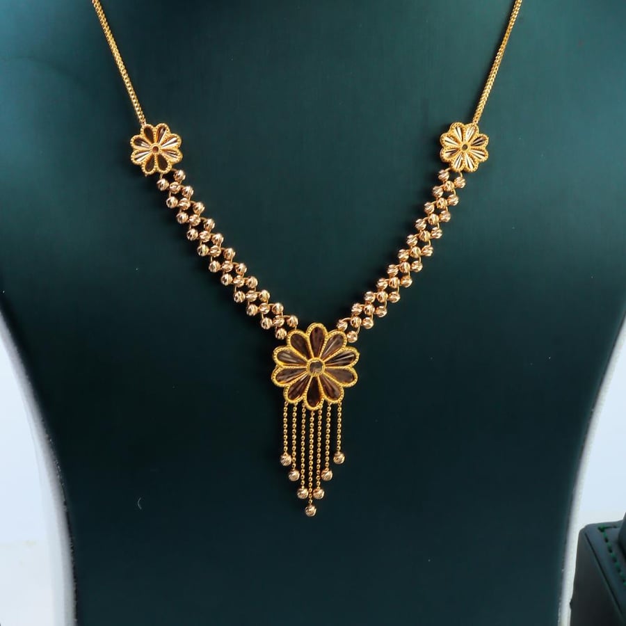 Rose gold set with Doric ball design, 21 karat, weighing 17.7 grams