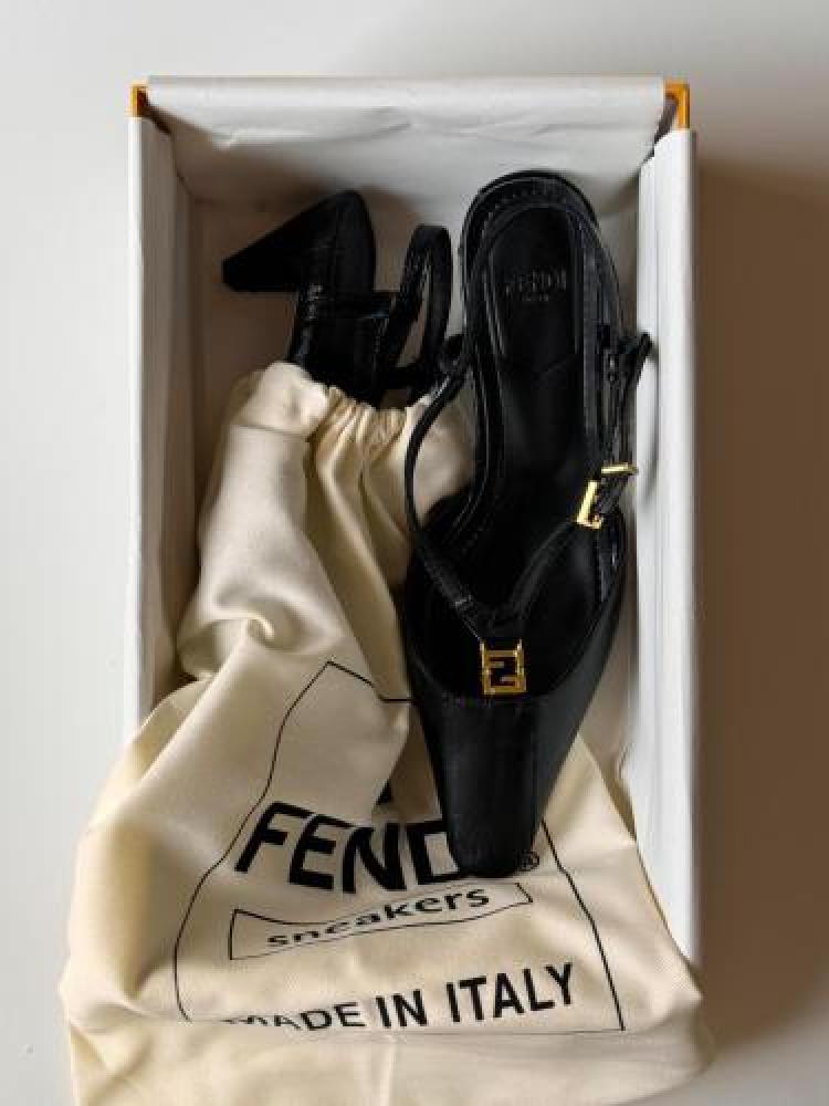Black luxury flip-flop with a back strap, fold design, and low heel