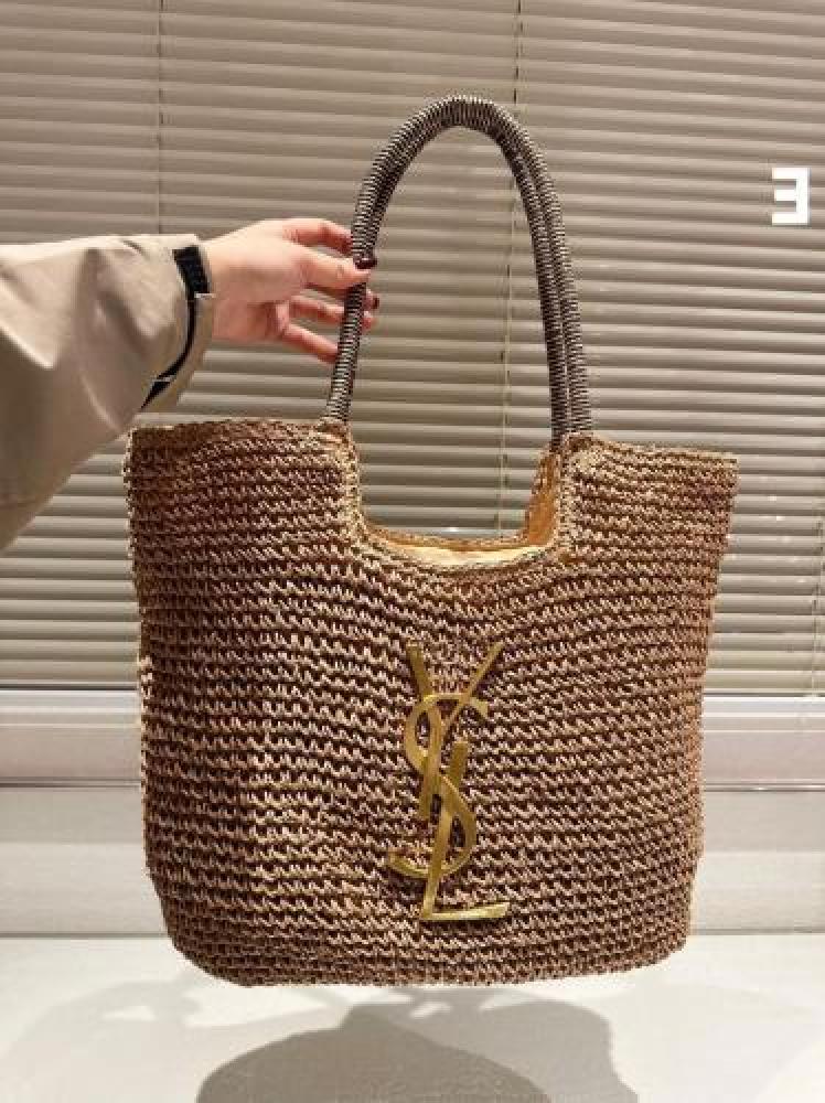 Saint Laurent hand bag from natural straw with handles wrapped in two colors and a gold metal logo