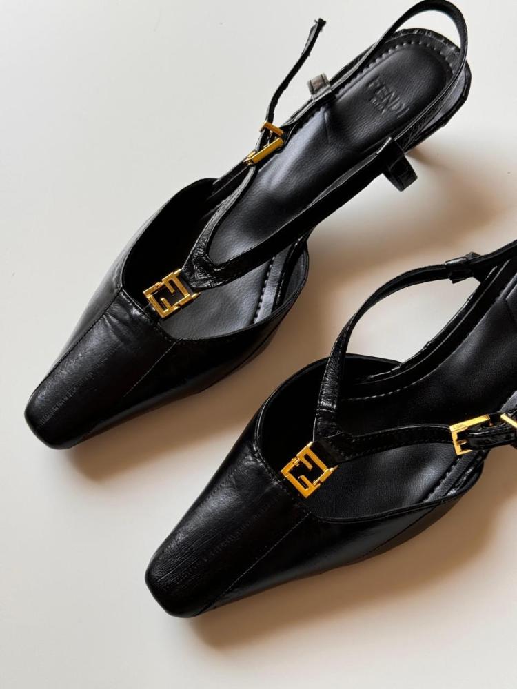 Black luxury flip-flop with a back strap, fold design, and low heel