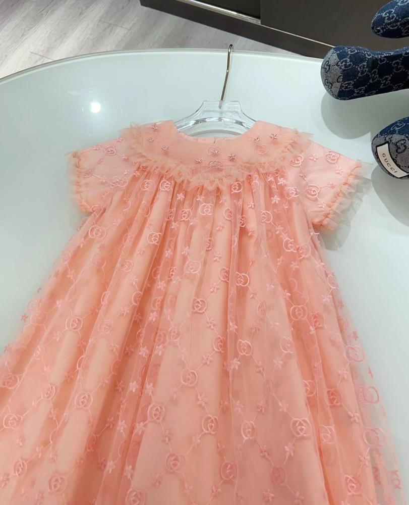 Gucci dress with embroidered fabric and brand logo