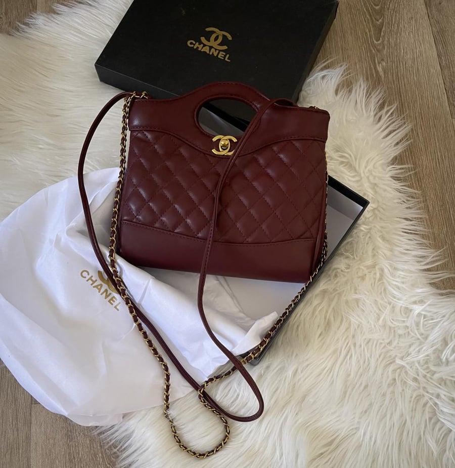 Chanel Nano bag in matte burgundy color with strap