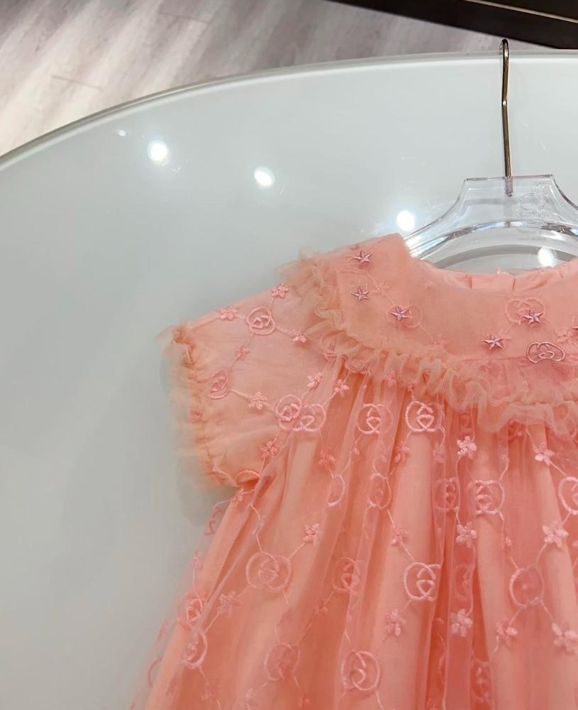 Gucci dress with embroidered fabric and brand logo