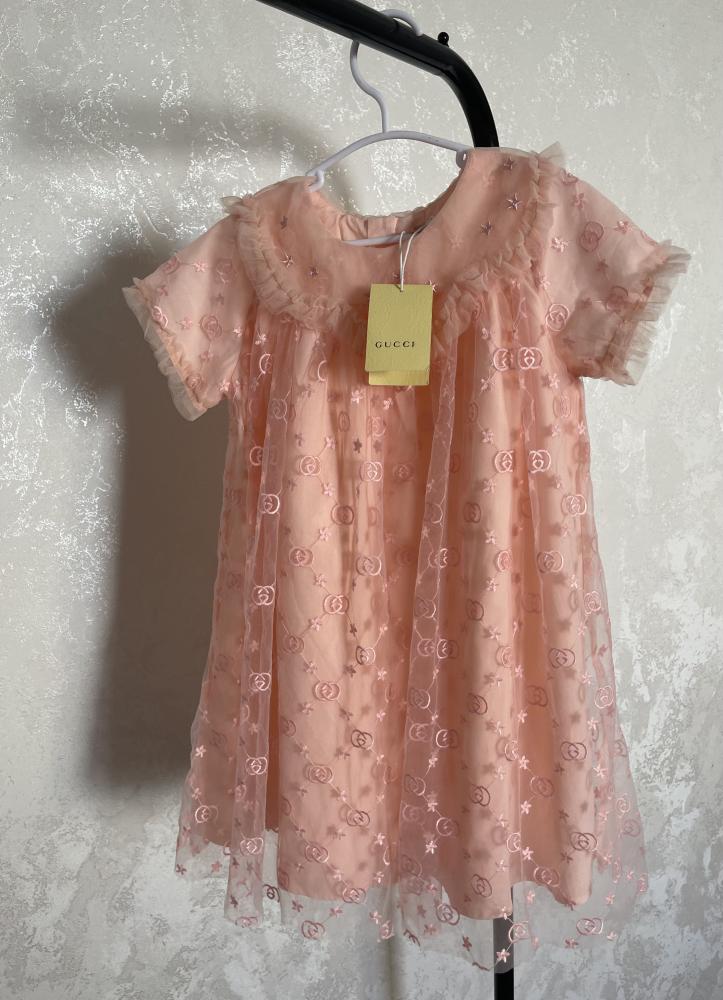Gucci dress with embroidered fabric and brand logo