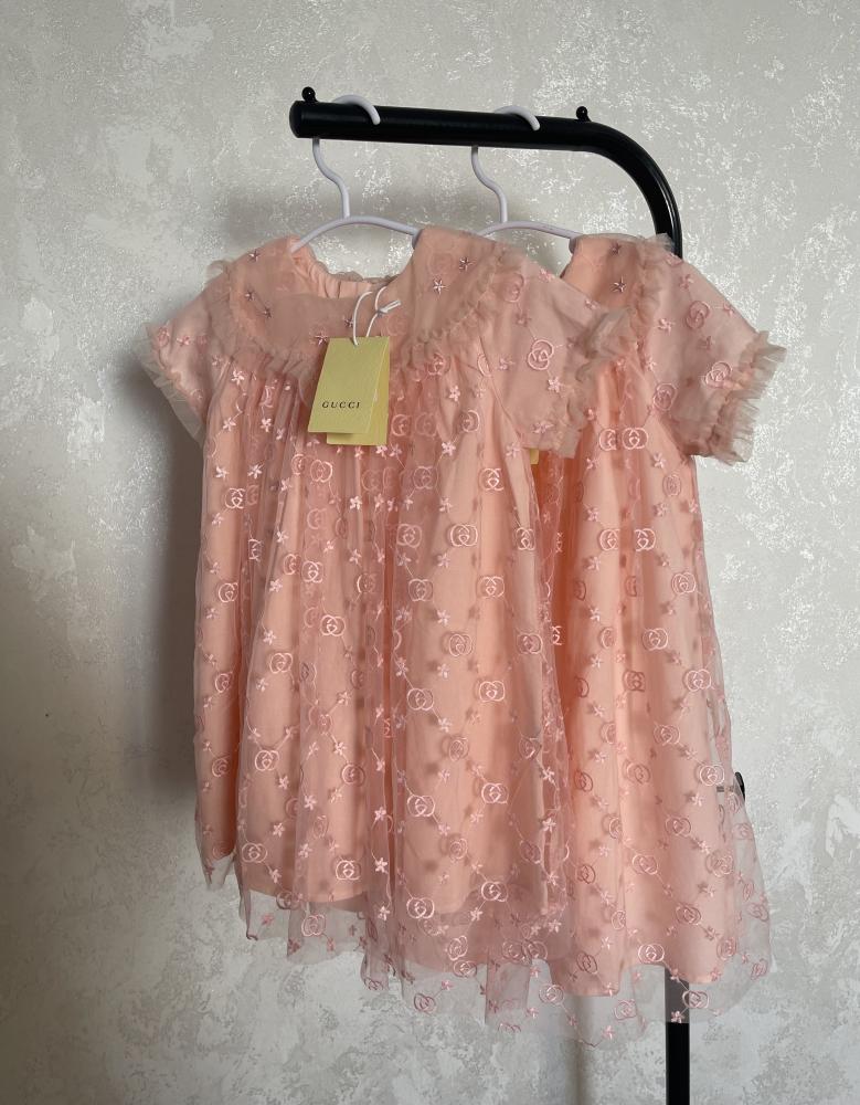 Gucci dress with embroidered fabric and brand logo