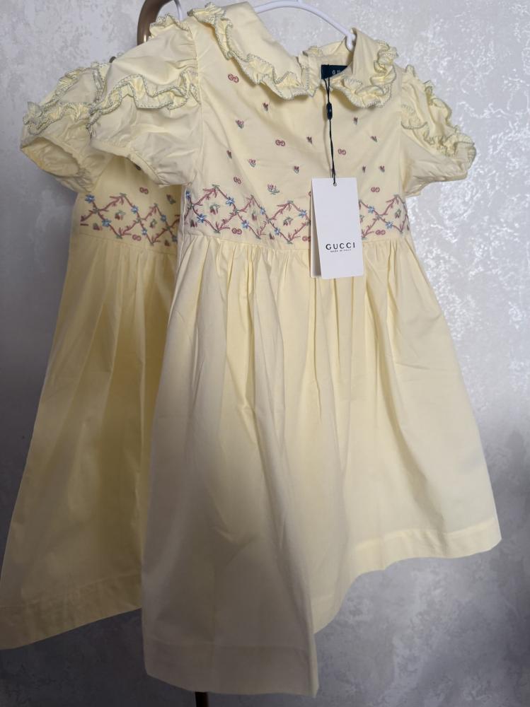Gucci lemon-colored elegant dress decorated with ruffles on the collar and shoulder