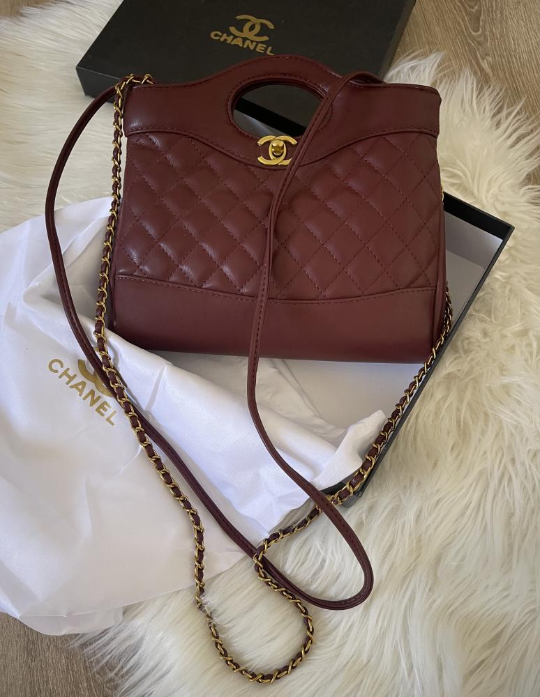Chanel Nano bag in matte burgundy color with strap