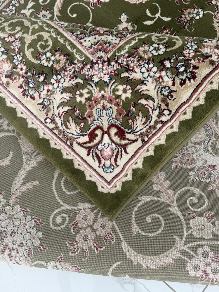 Elegant green classic carpet with luxurious oriental patterns