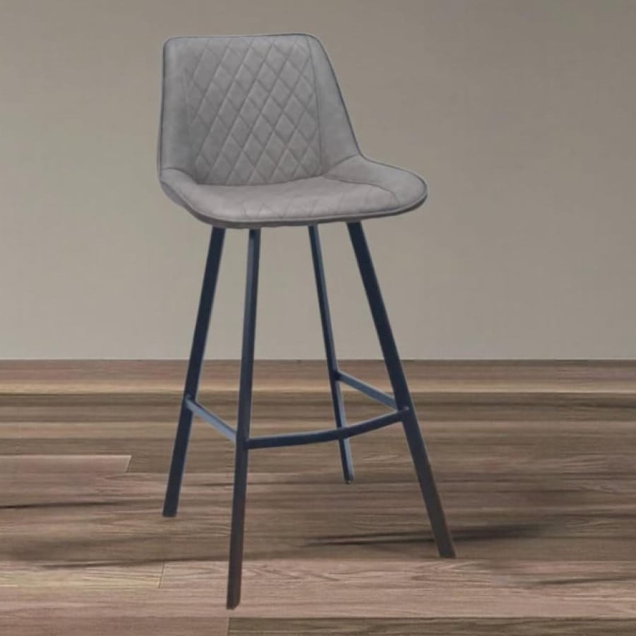 An aubergine leather bar stool with a four-legged black metal base.