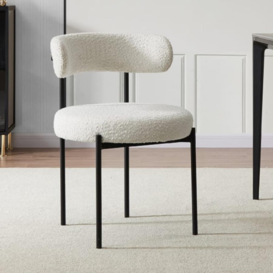 White fabric bar stool with four metal legs in black color