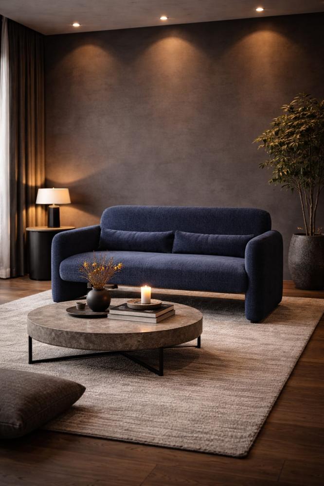 كنبة ثنائية بلون أزرق داكن بتصميم منحني وقماش ناعم فاخر