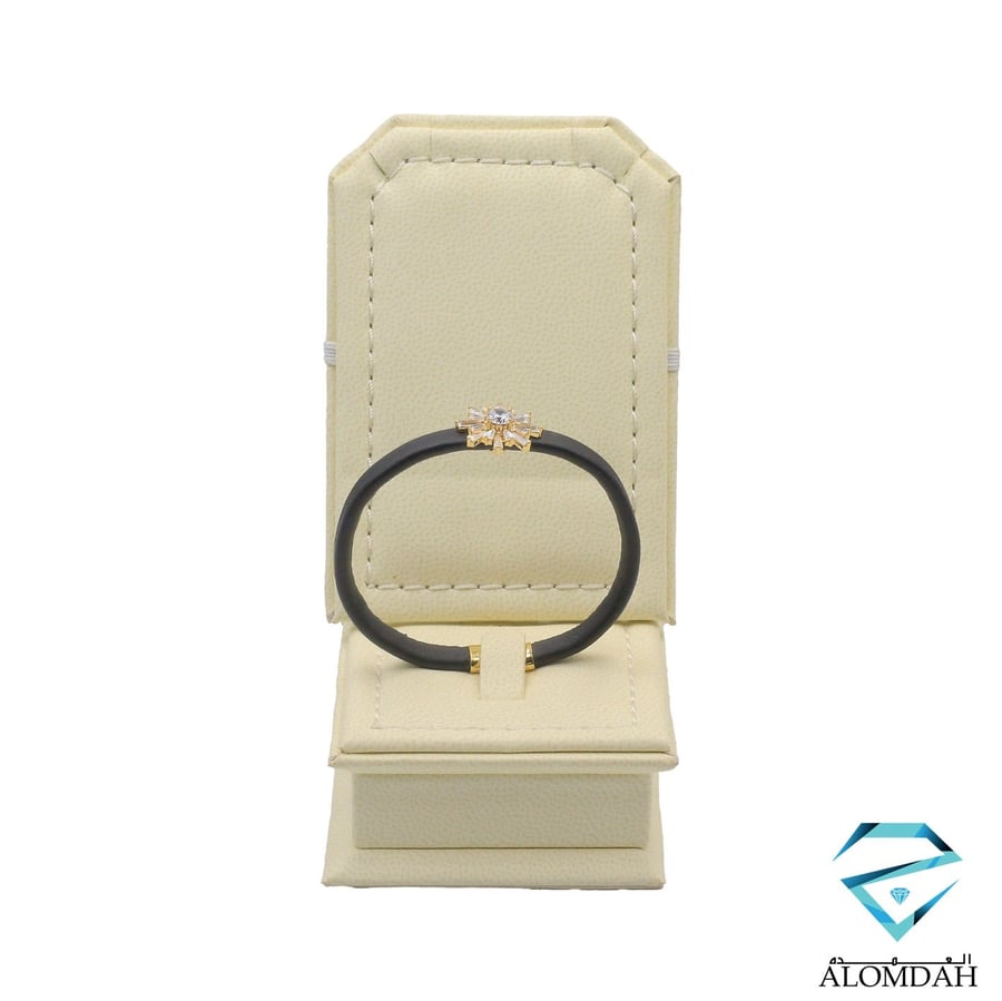 Leather bracelet with a gold accent and an open size