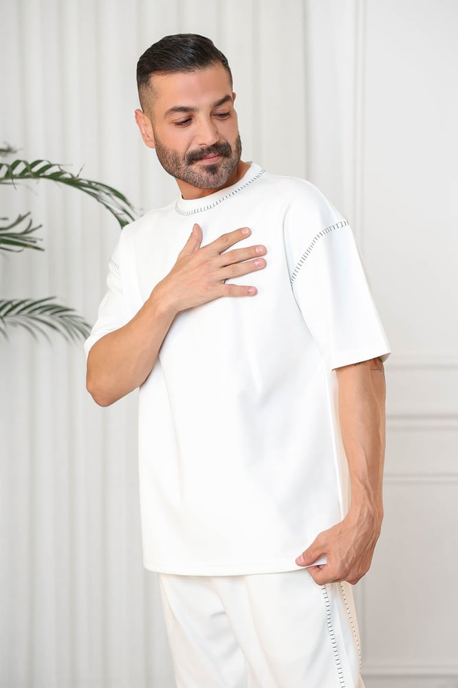 Men's oversized set, short sleeves, long pants, round collar decorated with colorful stitches on the T-shirt and the pants