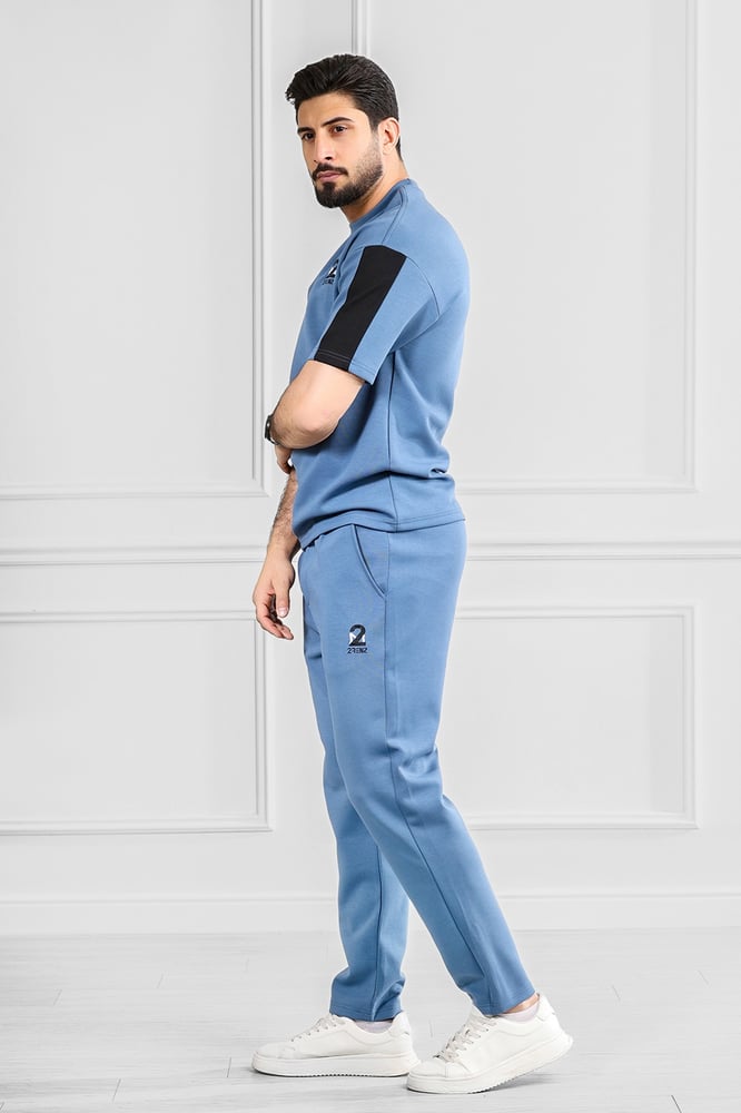 Men's oversized set, half sleeve, long pants, T-shirt decorated with embroidery in a different color, with a small-sized print of the Tornz brand.