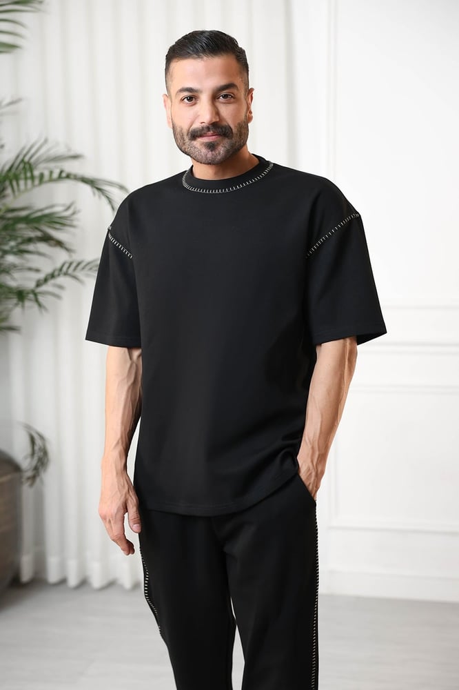 Men's oversized set, short sleeves, long pants, round collar decorated with colorful stitches on the T-shirt and the pants