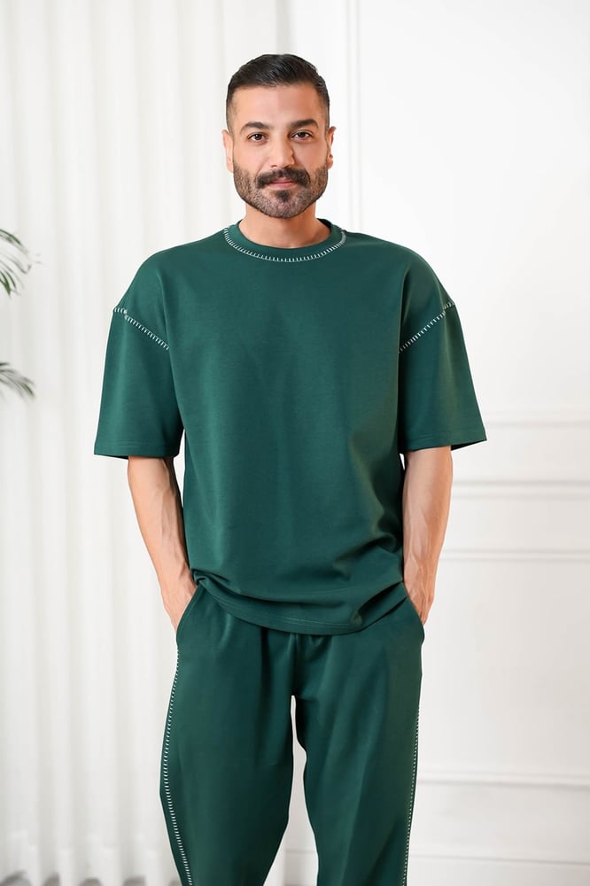 Men's oversized set, short sleeves, long pants, round collar decorated with colorful stitches on the T-shirt and the pants