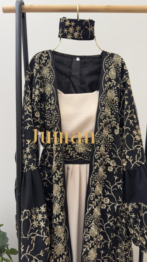 Beige dress and black cloak with gold embroidery
