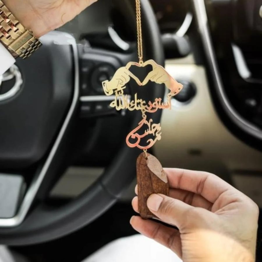 Car comments in the shape of two hands forming a heart