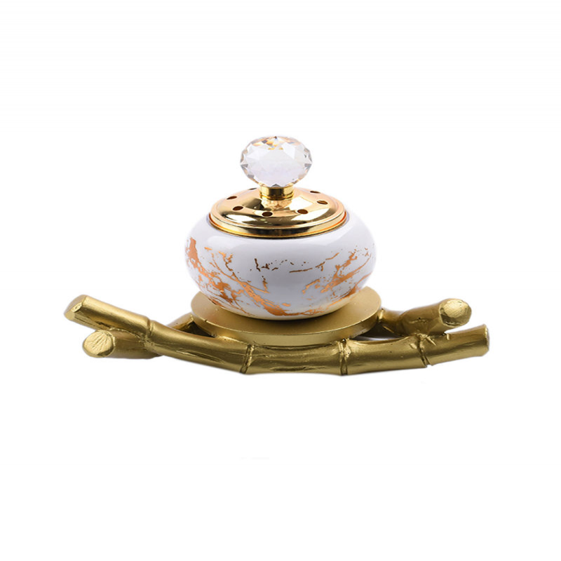 Ceramic incense burner with wooden base in Saudi Arabia