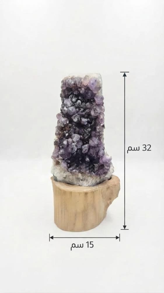 A masterpiece of luxurious natural purple amethyst stone on a handcrafted wooden base