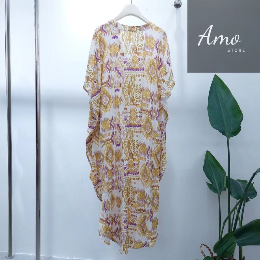 Yellow mango-colored dress, loose size, with front buttons from top to bottom, full-length with puffed sleeves, butterfly sleeves, floral fabric with beautiful colors and patterns, MADS3415