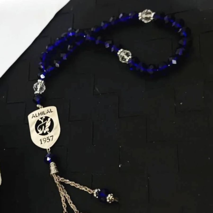 سبح بالاسم مع شعار نادي الهلال