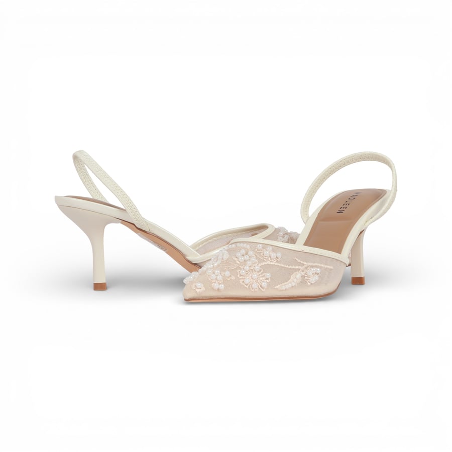 The shoes are mesh decorated with pearls, heel of a fork from Madeleine, white