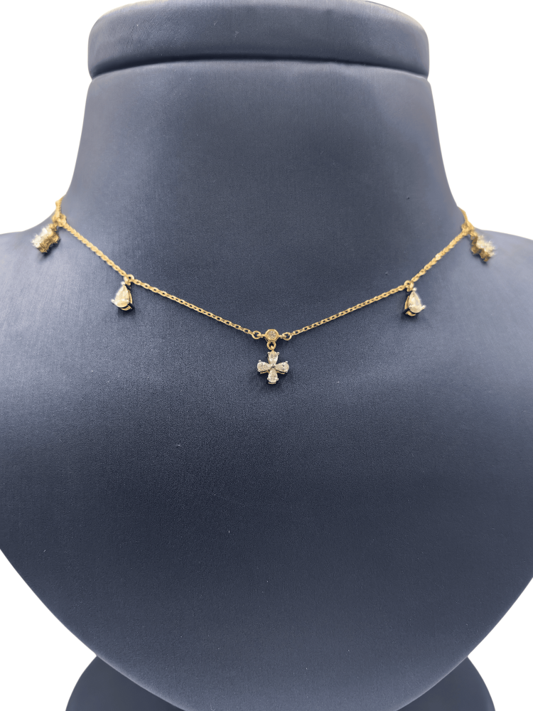 Silver flower with a four-leaf clover and a teardrop story