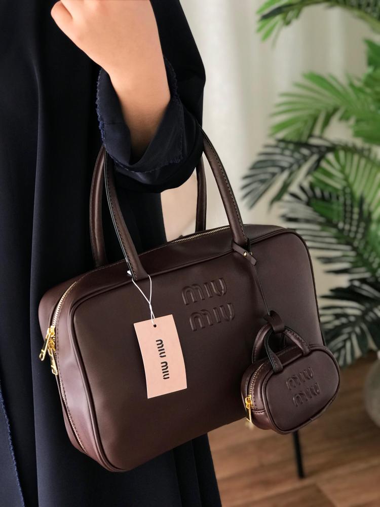 شنطه ميوميو مع التعليقه