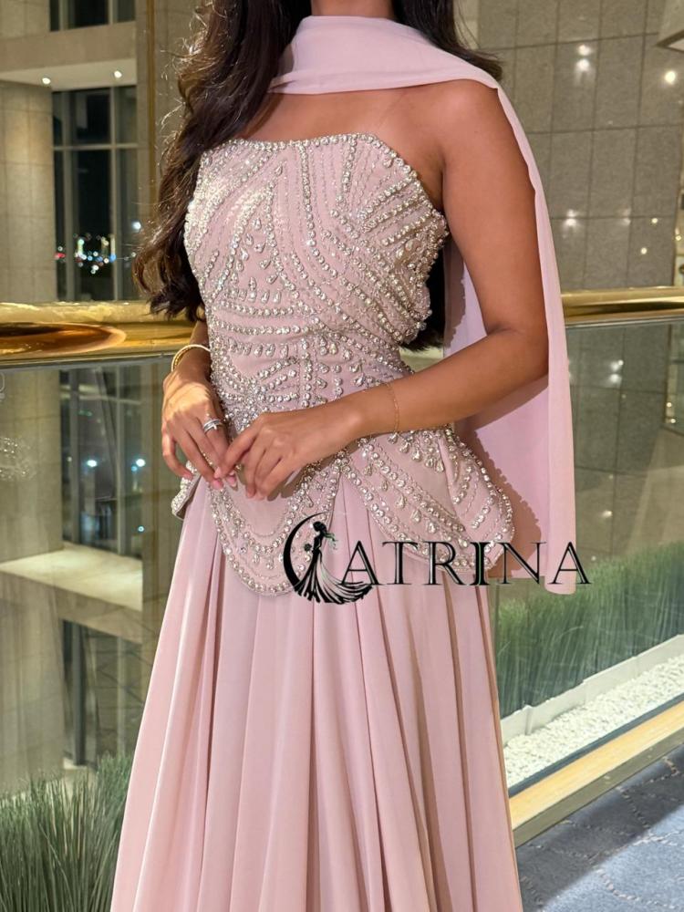 Evening dress with luxurious pearl embroidery and flowing skirt