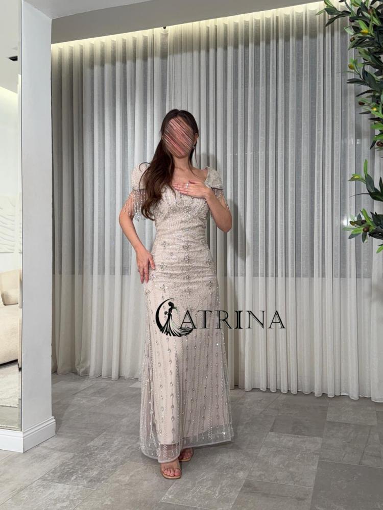 Evening gown champagne embroidered with crystal details and luxurious shoulders