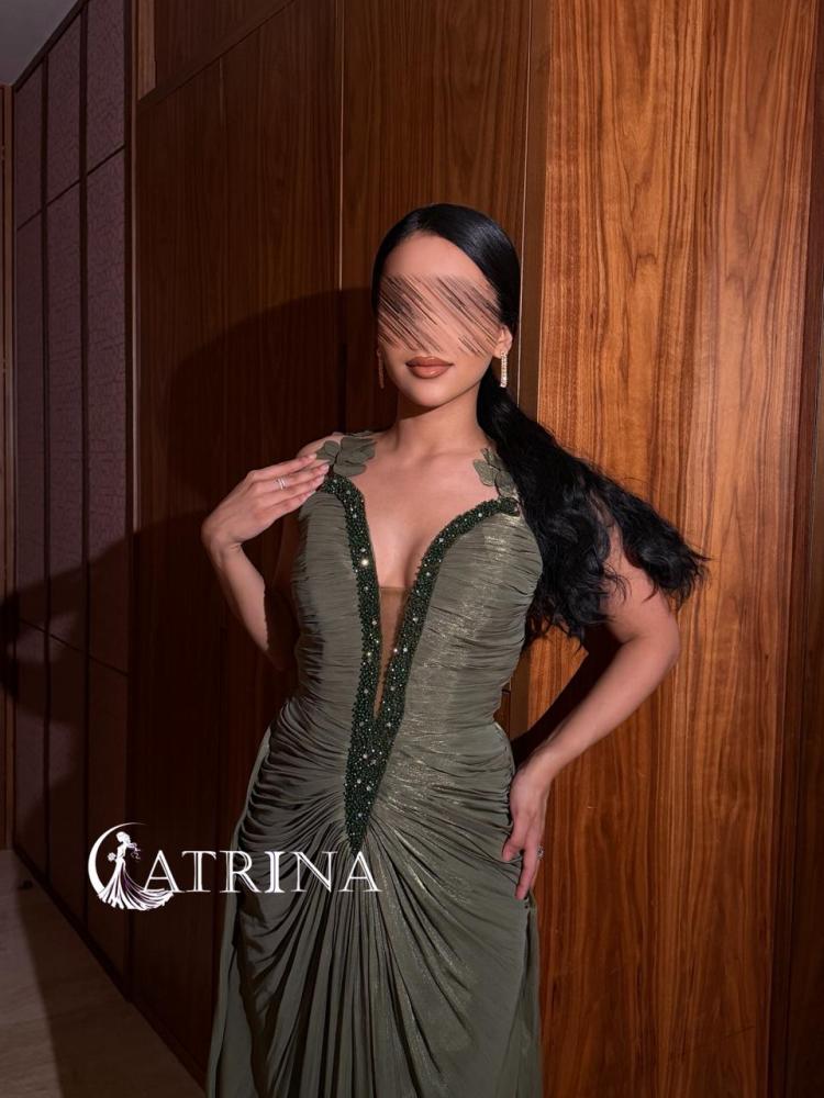 Evening dress with draped design and luxurious embroidery