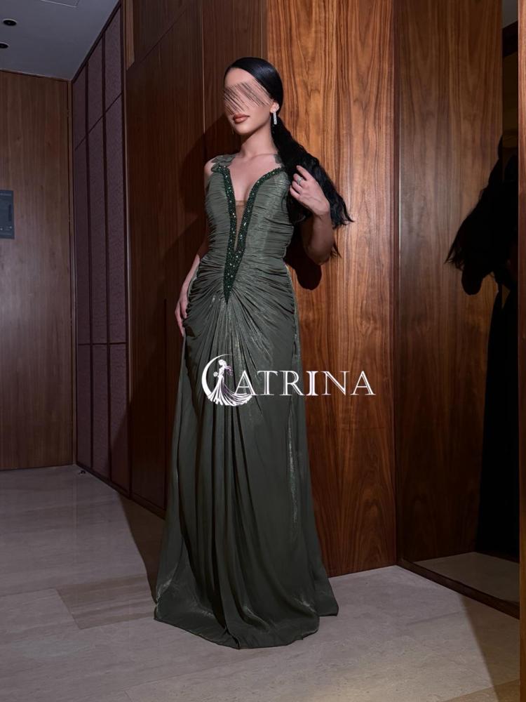 Evening dress with draped design and luxurious embroidery